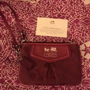 Coach signature collection wristlet.